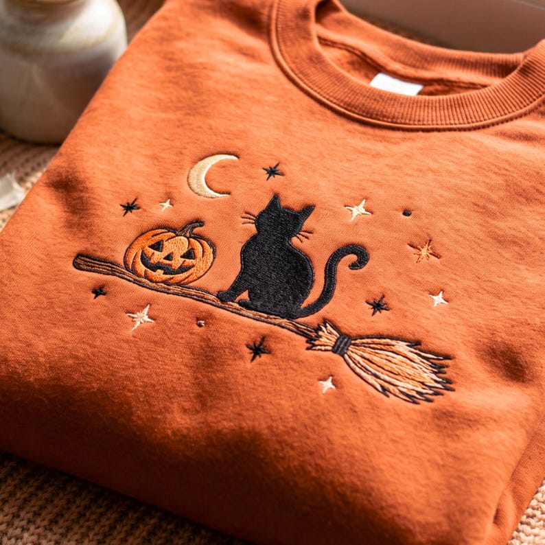 Embroidered Black Cat Broomstick Sweatshirt – Cozy Halloween Apparel