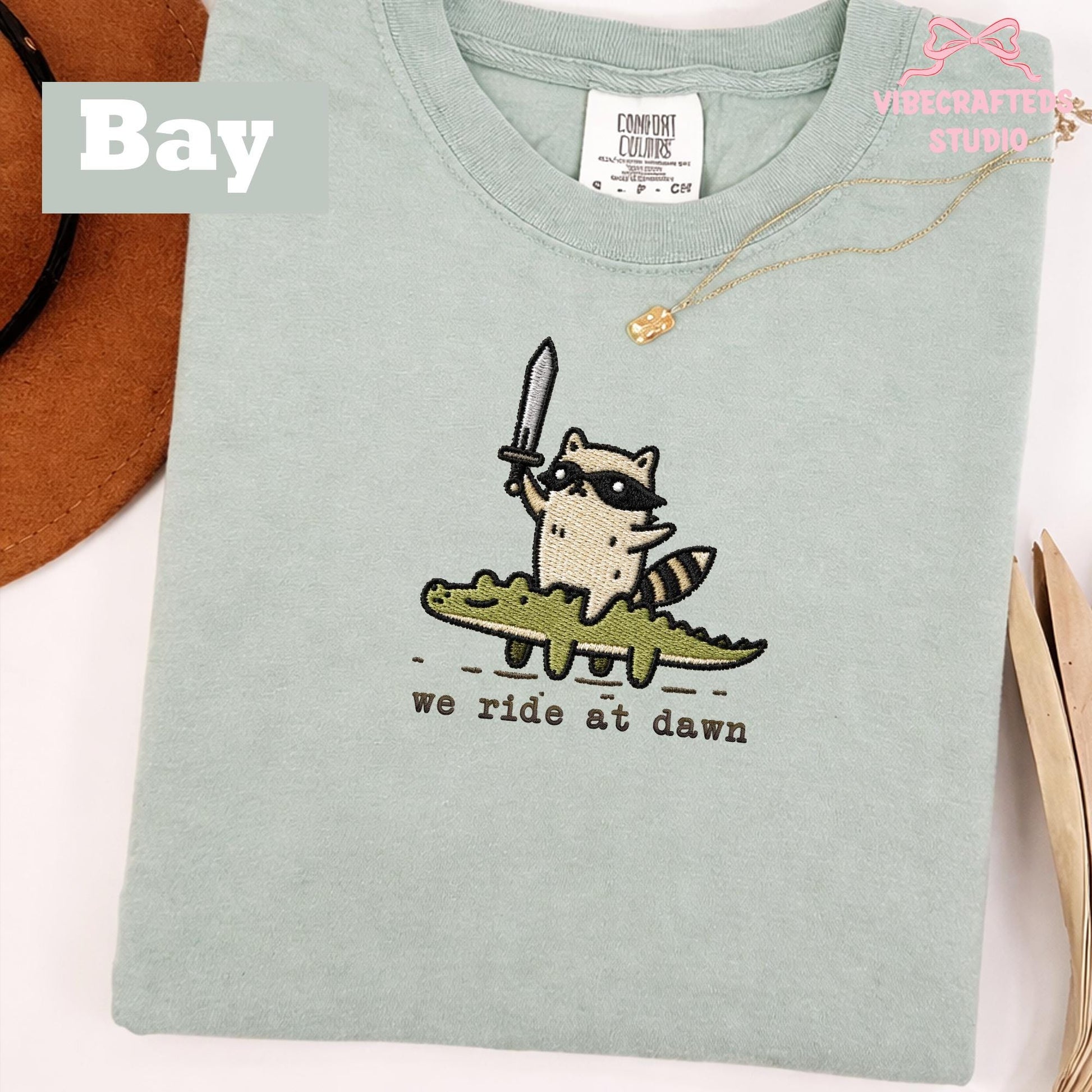 We Ride At Dawn Embroidered Raccoon Shirt, Funny Trash Panda Comfort Colors Tee
